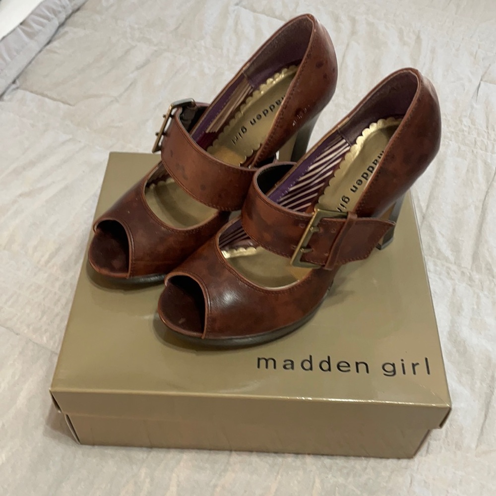 Dark brown high heeled peep toe Mary Janes with buckle accent. Women’s size 7